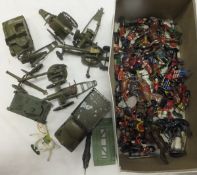 A large collection of vintage die-cast military vehicles, soldiers, etc, to include artillery