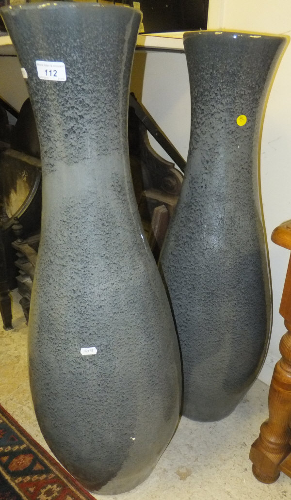 A large pair of slender baluster shaped vases in the Chinese taste with smoky grey speckled glaze