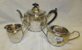 A silver three piece tea set of tapering faceted form with beaded edge rim (by R.G.H, Birmingham