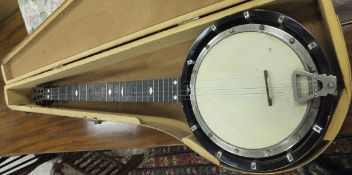 A four and a half string 'zither' banjo, bearing maker's label to the back of the head stock "