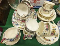 A Wedgwood foliate decorated part tea set and Royal Cauldon "Victoria" pattern part tea set