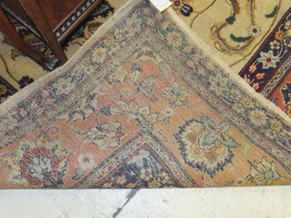 A Tabriz carpet, the central cream field with stylised floral decoration in blue, red, green and - Image 6 of 7