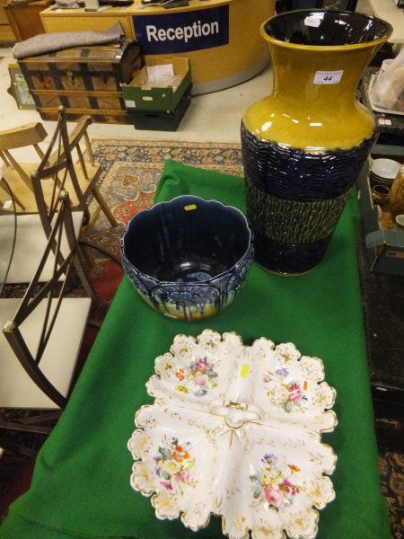 A German stoneware vase with ochre glazed flared rim, an English pottery planter in the Victorian