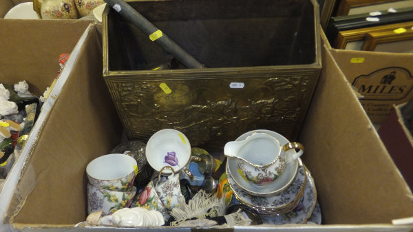 A box containing assorted decorative items to include two Coalport ladies, tea set, etc