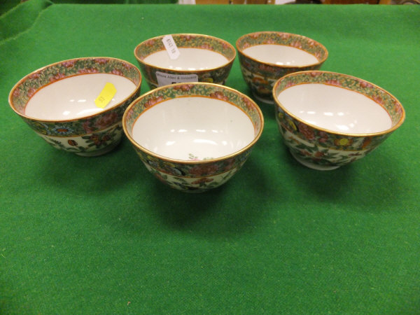 A collection of five Chinese porcelain famille-rose rice bowls