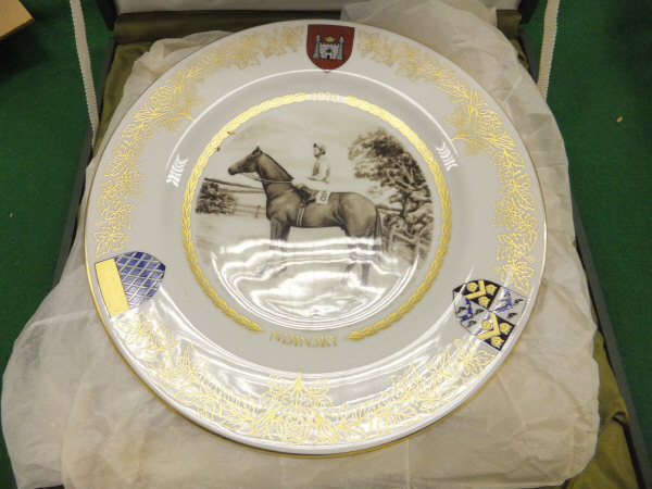 A collection of nine collector's plates, contained within various presentation boxes, to include