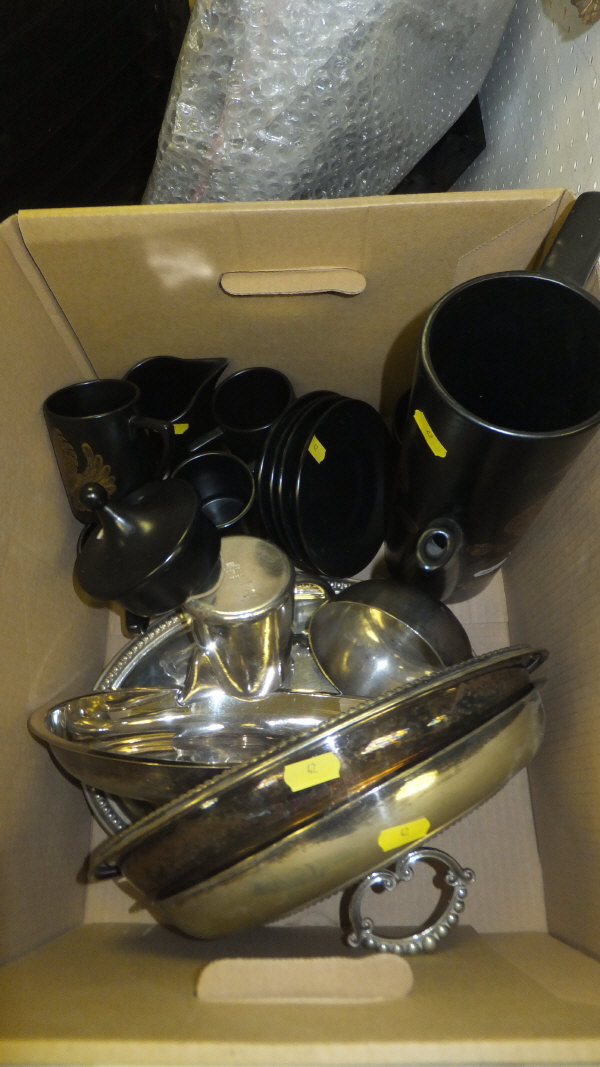 A box containing two plated entree dishes, a plated sugar bowl and milk jug and a Portmeirion