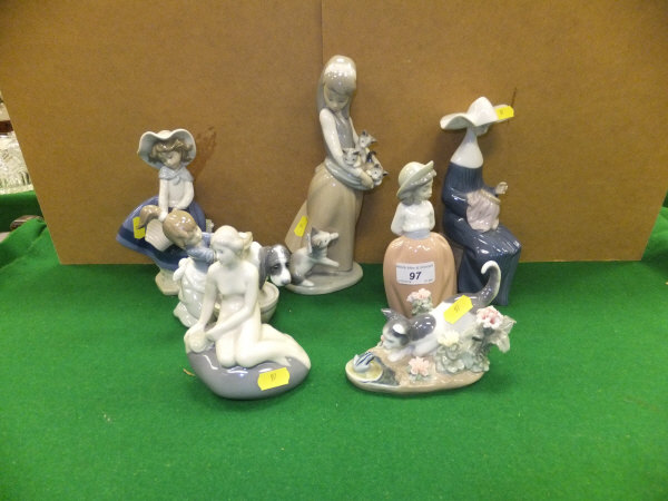 A collection of five Lladro figures to include "Girl with kittens", "A nun", "Girl with basket", "