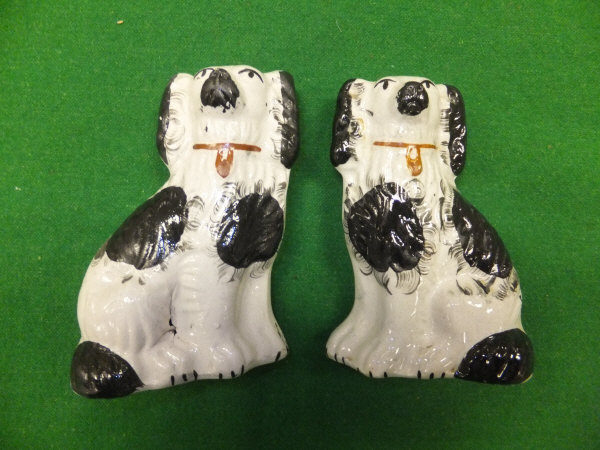 A pair of small Staffordshire pottery spaniels