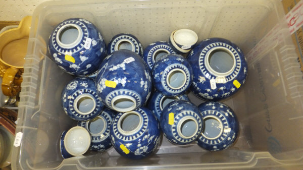 A box containing a collection of blue and white prunus decorated Oriental ginger jars