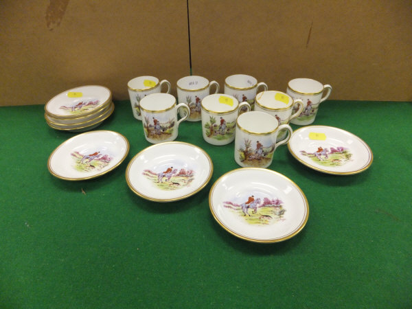 A collection of eight coffee cans and saucers by Royal Chelsea and New Chelsea, each decorated