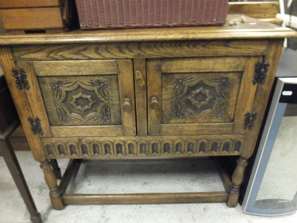 A 20th century oak two door cupboard in the 17th century manner