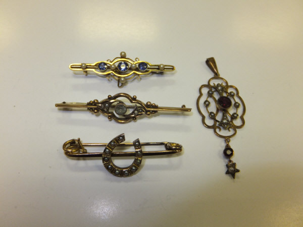 A Victorian 15 carat gold bar brooch set with pearl and blue sapphire, and a similar 9 carat gold
