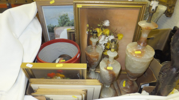 A box containing three onyx table lamps, various pictures, a modern leather covered waste basket,