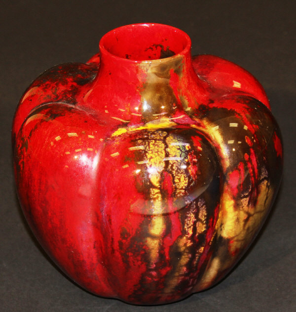 A Royal Doulton flambé Sung vase of squash form, decorated by Frank Marshall, 17 cm high