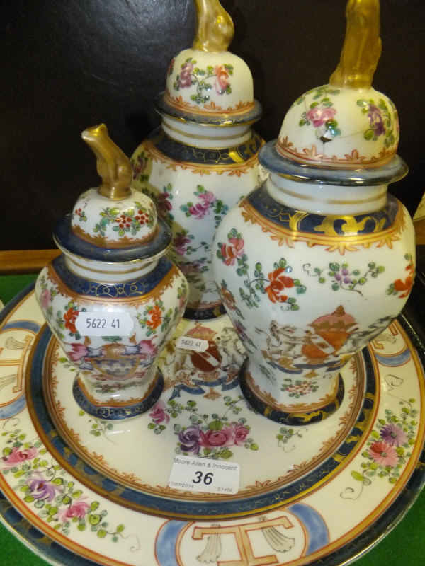 A graduated set of three 19th Century Samson porcelain armorial china hexagonal baluster shaped jars