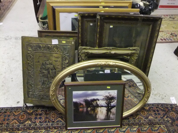A large collection of various pictures, mirrors, etc