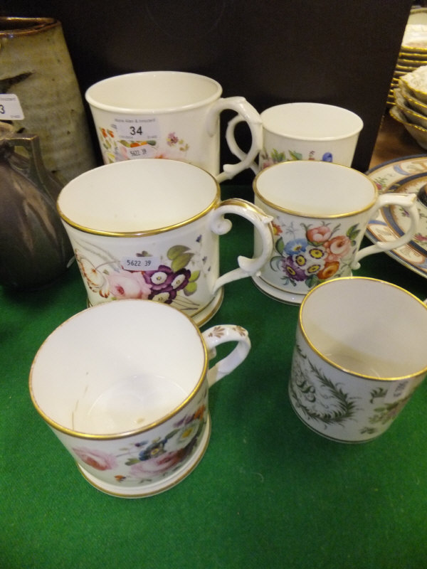 A collection of six 19th Century floral spray decorated mugs to include one bearing initials in