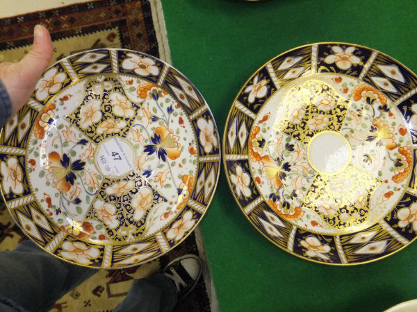 A pair of 19th Century Derby porcelain shallow dishes decorated in the Imari palette