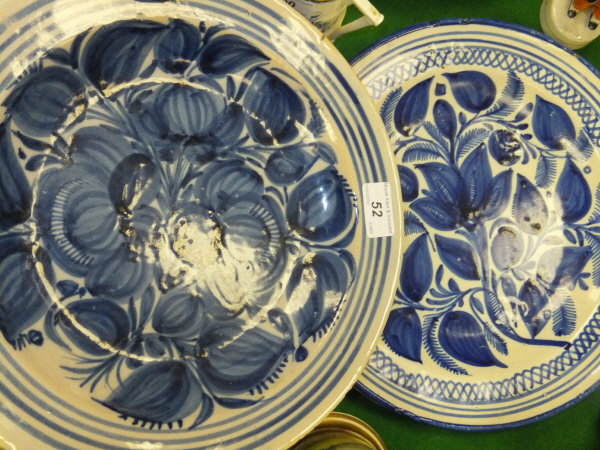 Two 19th century French faience decorated dishes, each decorated with blue on a cream ground, with