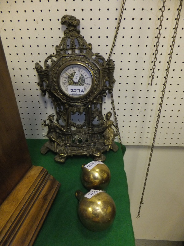 A reproduction Dutch style wall clock and another modern brass mantel clock
