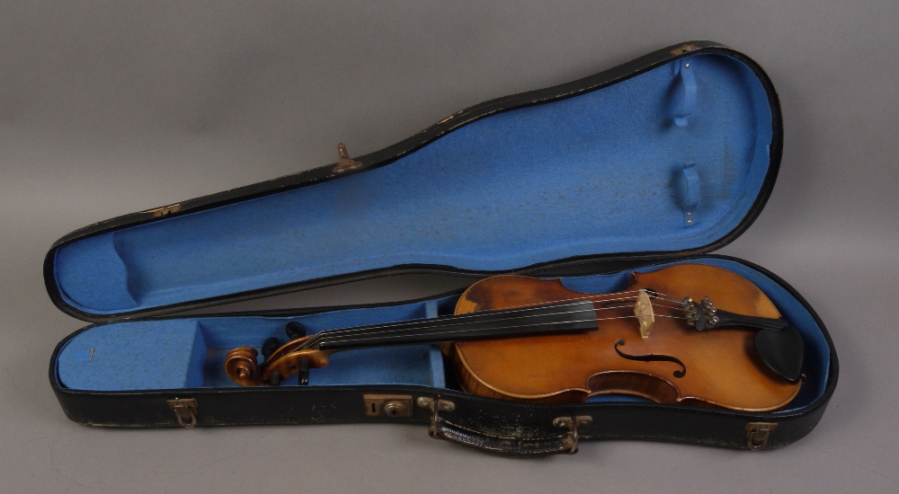 A German violin labelled Nicolans Amatus, 19th century, the one piece back with medium slanted curl,