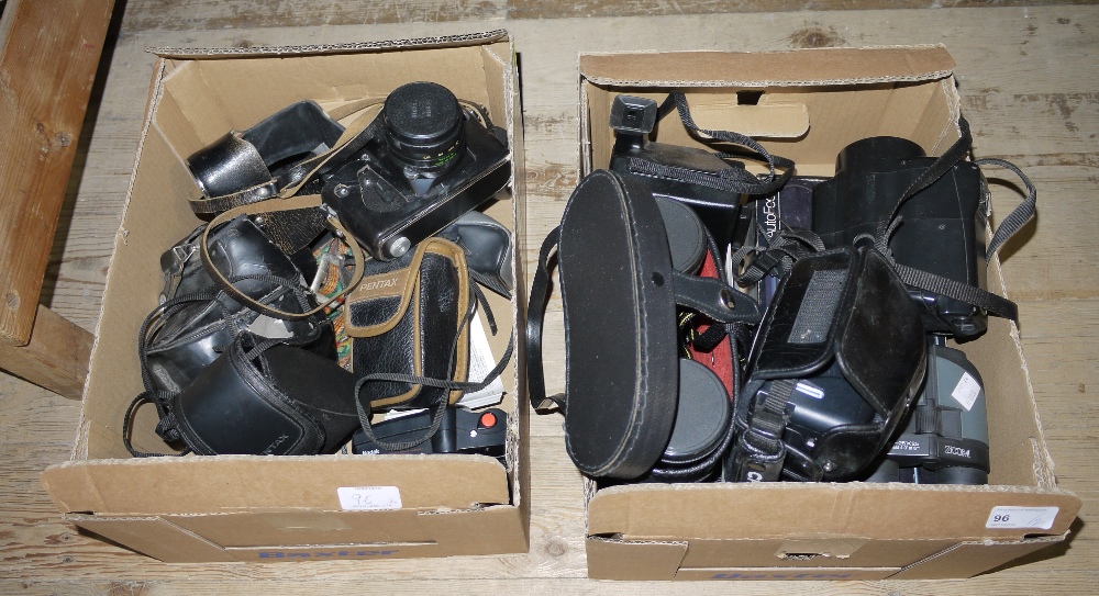 A collection of cameras and binoculars including a pair of Miranda 16 x 50 field glasses, pair of