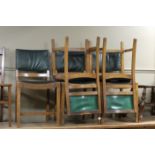 A set of five oak dining chairs with lea