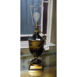A black and gilt lacquered table lamp of