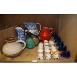 Blue and white and other pottery jugs, e