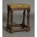 An 18th century oak joint stool the seat