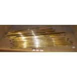 A quantity of brass stair rods