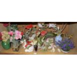 Various faux flowers and plants in a var
