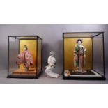 Three Japanese Kyugetsu porcelain dolls,