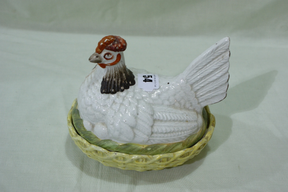A Staffordshire Pottery Coloured Hen On Nest