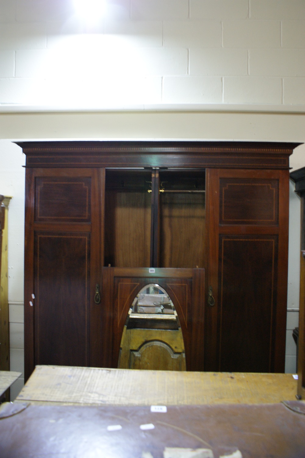 An Edwardian Mahogany Two Door Gentleman`s Wardrobe With Centre Mirrored Panel