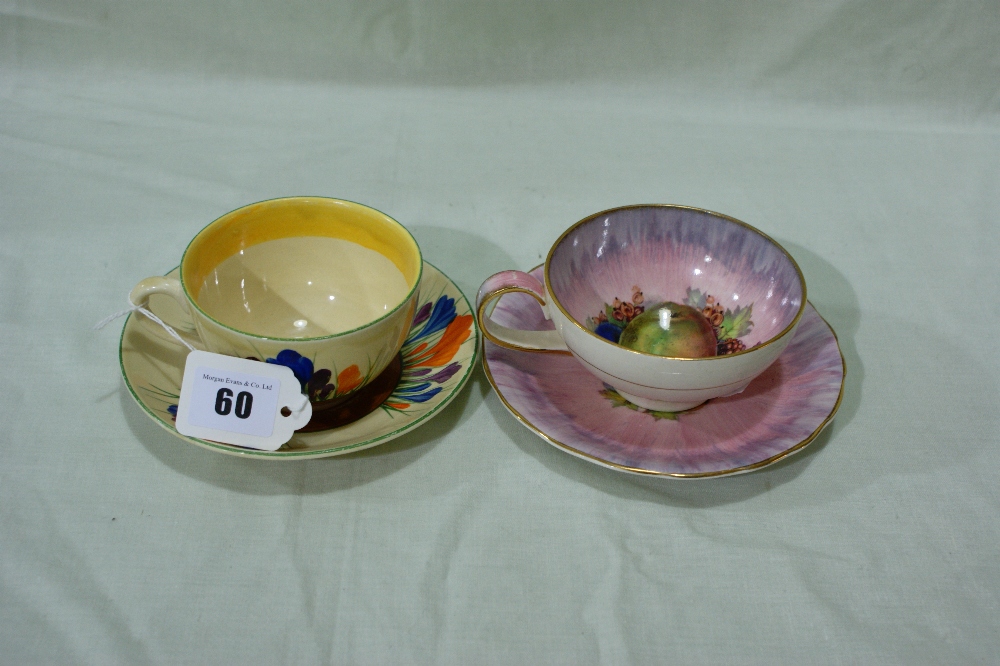 A Clarice Cliff Crocus Pattern Tea Cup And Saucer Together With A Further Fruit Decorated Clarice