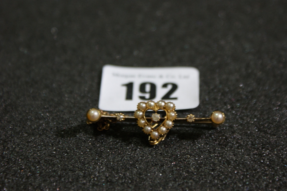 A Mother Of Pearl And Diamond Gold Set Hart Motif Bar Brooch