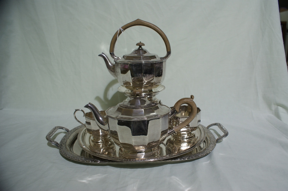 A Sheffield Plate Four Piece Tea Service Including Spirit Kettle On Stand, Together With Two