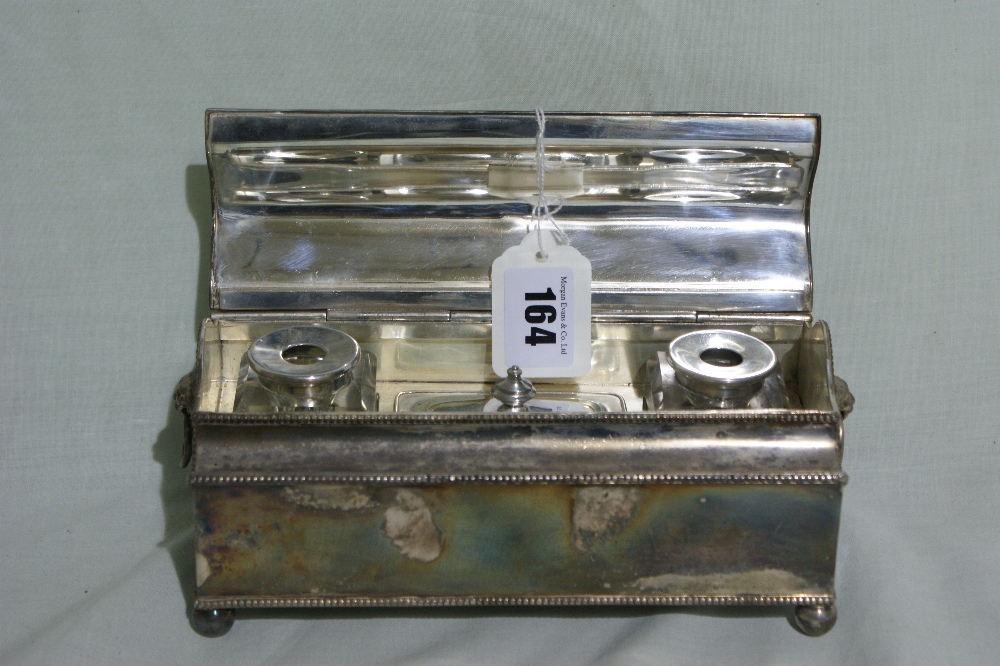 A Silver Plated Desk Stand Fitted With Two Inkwells