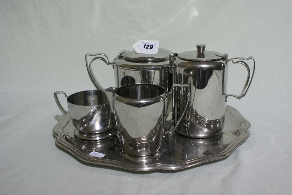 A Four Piece Olde Hall Stainless Steel Tea Service On A Circular Tray