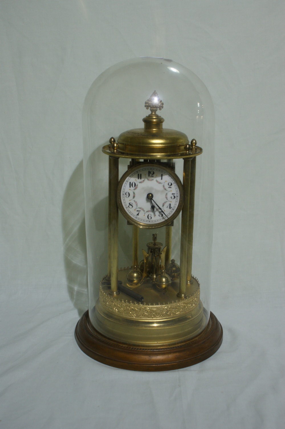 An Early 20th Century Anniversary Clock Under A Cylindrical Dome