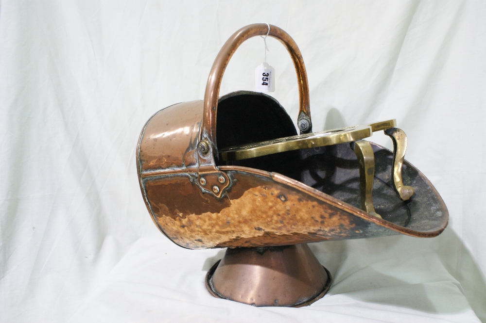 An Antique Copper Coal Scuttle Together With A Brass Trivet Stand