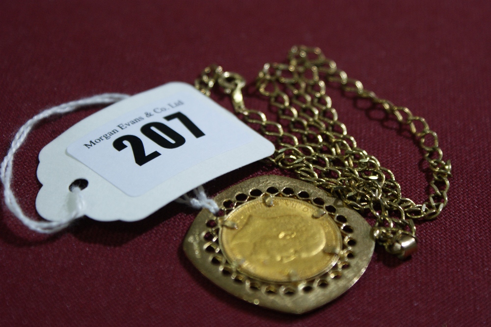 A 1908 Full Gold Sovereign With In A 9 Carat Gold Mount And Chain