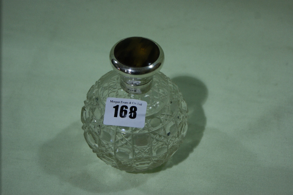 A Silver And Tortoise Shell Topped Glass Dressing Table Jar