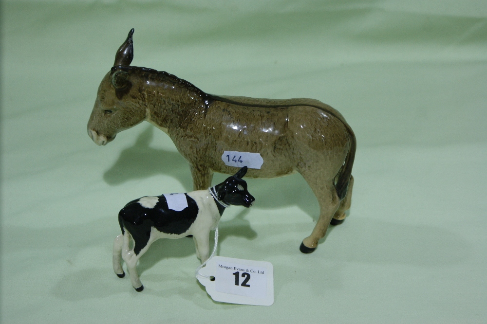 A Beswick Model Donkey Together With A Beswick Model Friesian Calf (Both AF)