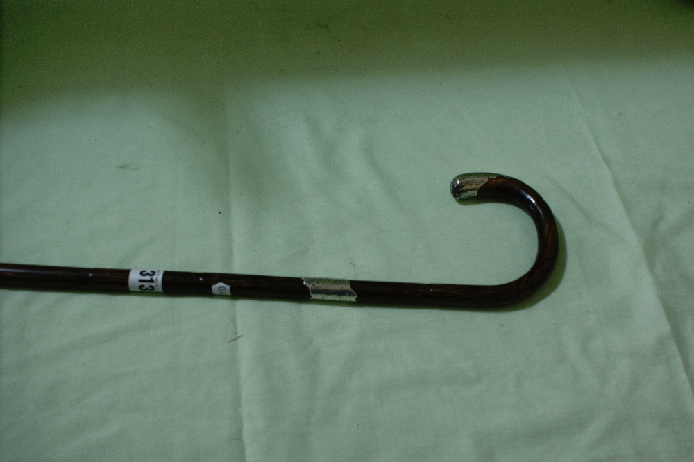 A Victorian Walking Stick With Silver Mounts