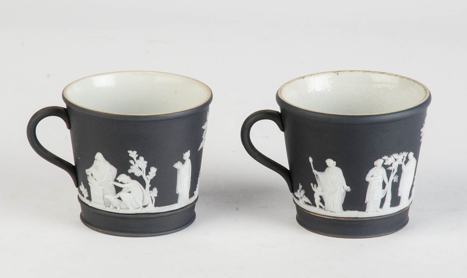 A pair of Wedgwood black jasper cups and saucers, English, 19th century 7cm high