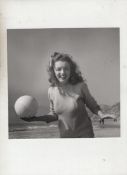 Marilyn Monroe original bw photograph showing Marilyn on Tobey beach holding a ball in her right
