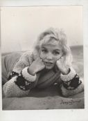 Marilyn Monroe original bw photograph showing Marilyn in thick woollen jumper lying on Tobey beach